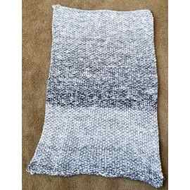 This Hand Knit Rug / Throw/ Blanket Shades of Gray and White  35.5" x 26" is made with love by The Creative Soul Sisters! Shop more unique gift ideas today with Spots Initiatives, the best way to support creators.