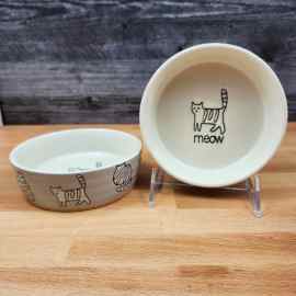 This Cat Water Food Bowl Set of 2 Embossed Treat Dish is made with love by Premier Homegoods! Shop more unique gift ideas today with Spots Initiatives, the best way to support creators.