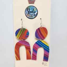 This Fishhook Pierced Earrings - Jewel toned rainbow arches is made with love by Studio Patty D! Shop more unique gift ideas today with Spots Initiatives, the best way to support creators.