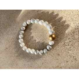 This White and Gray stretchy Bracelet is made with love by Adelu Jewelry! Shop more unique gift ideas today with Spots Initiatives, the best way to support creators.