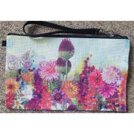 This Wristlet "Floral Infusion" is made with love by Studio Patty D! Shop more unique gift ideas today with Spots Initiatives, the best way to support creators.
